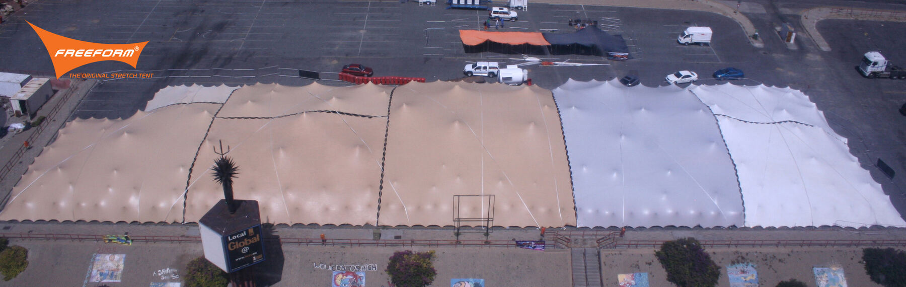 Aerial view of many stretch tents joined into one large cover